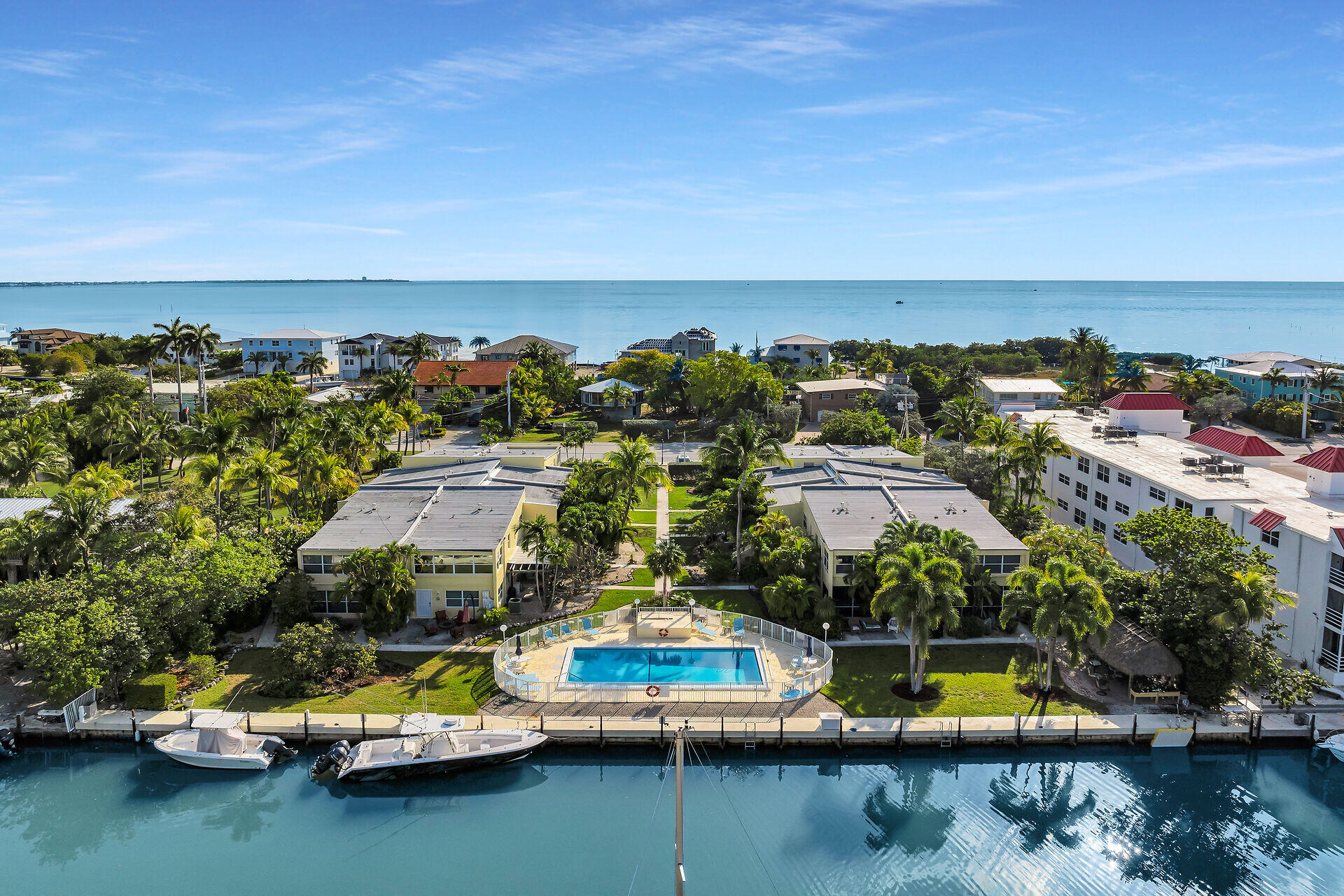 591 Sombrero Beach Road, Unit 8B Marathon, FL 33050 - Photo 8 of 43 an aerial view of a house with a swimming pool yard and outdoor seating