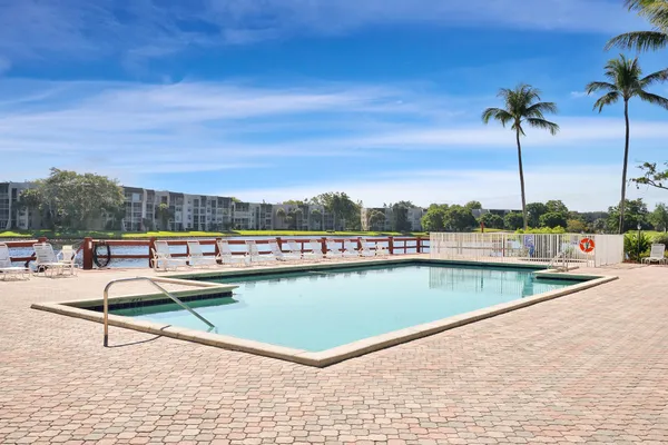a view of a swimming pool with a lounge chairs