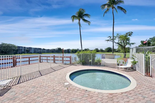 a view of a swimming pool with a yard