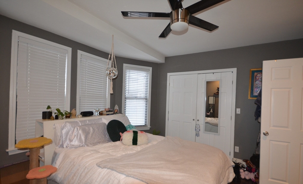 60 Florida Street, Unit 2 Boston, MA 02124 - Photo 13 of 25 a bedroom with a bed and furniture