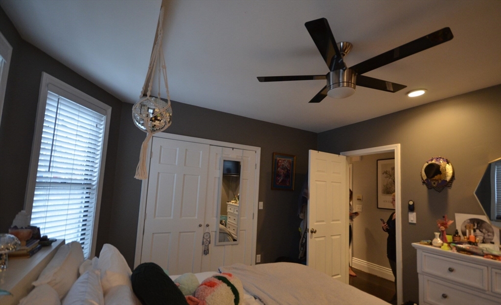 60 Florida Street, Unit 2 Boston, MA 02124 - Photo 14 of 25 a bedroom with a bed and a dresser