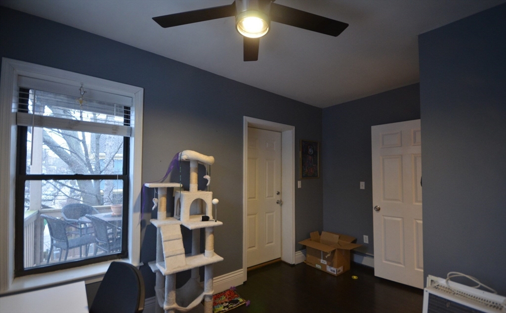 60 Florida Street, Unit 2 Boston, MA 02124 - Photo 18 of 25 a room with gym equipment and a window