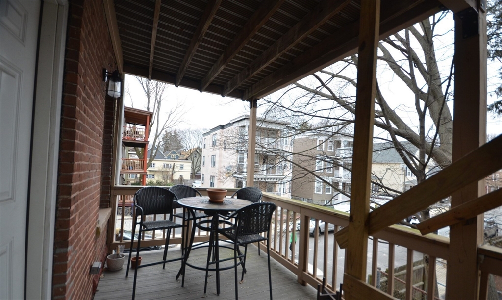 60 Florida Street, Unit 2 Boston, MA 02124 - Photo 24 of 25 a view of a porch with furniture and a yard