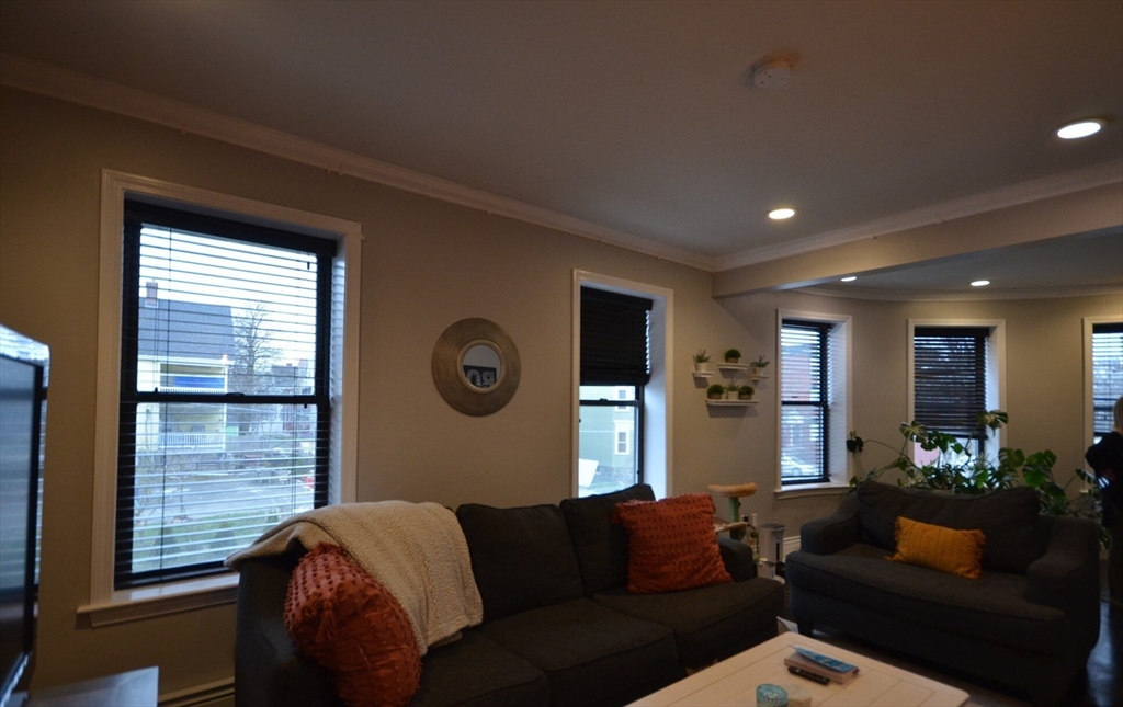 60 Florida Street, Unit 2 Boston, MA 02124 - Photo 4 of 25 a living room with furniture and a window