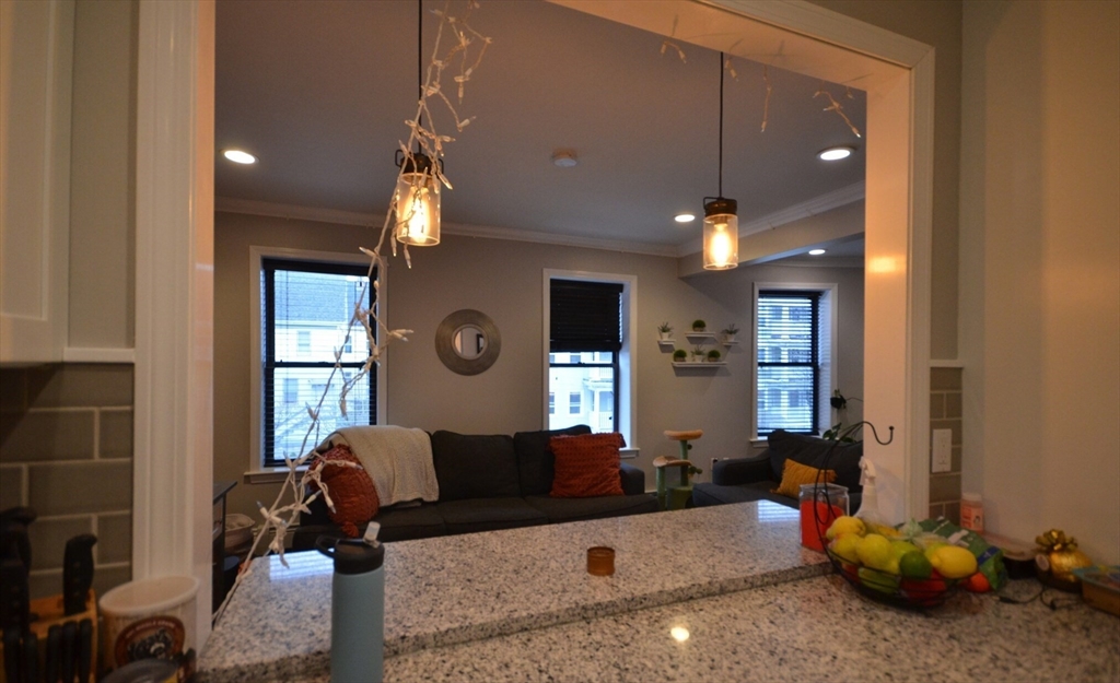 60 Florida Street, Unit 2 Boston, MA 02124 - Photo 7 of 25 a living room with furniture and a large window