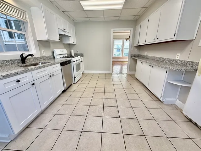 a kitchen with a sink and cabinets
