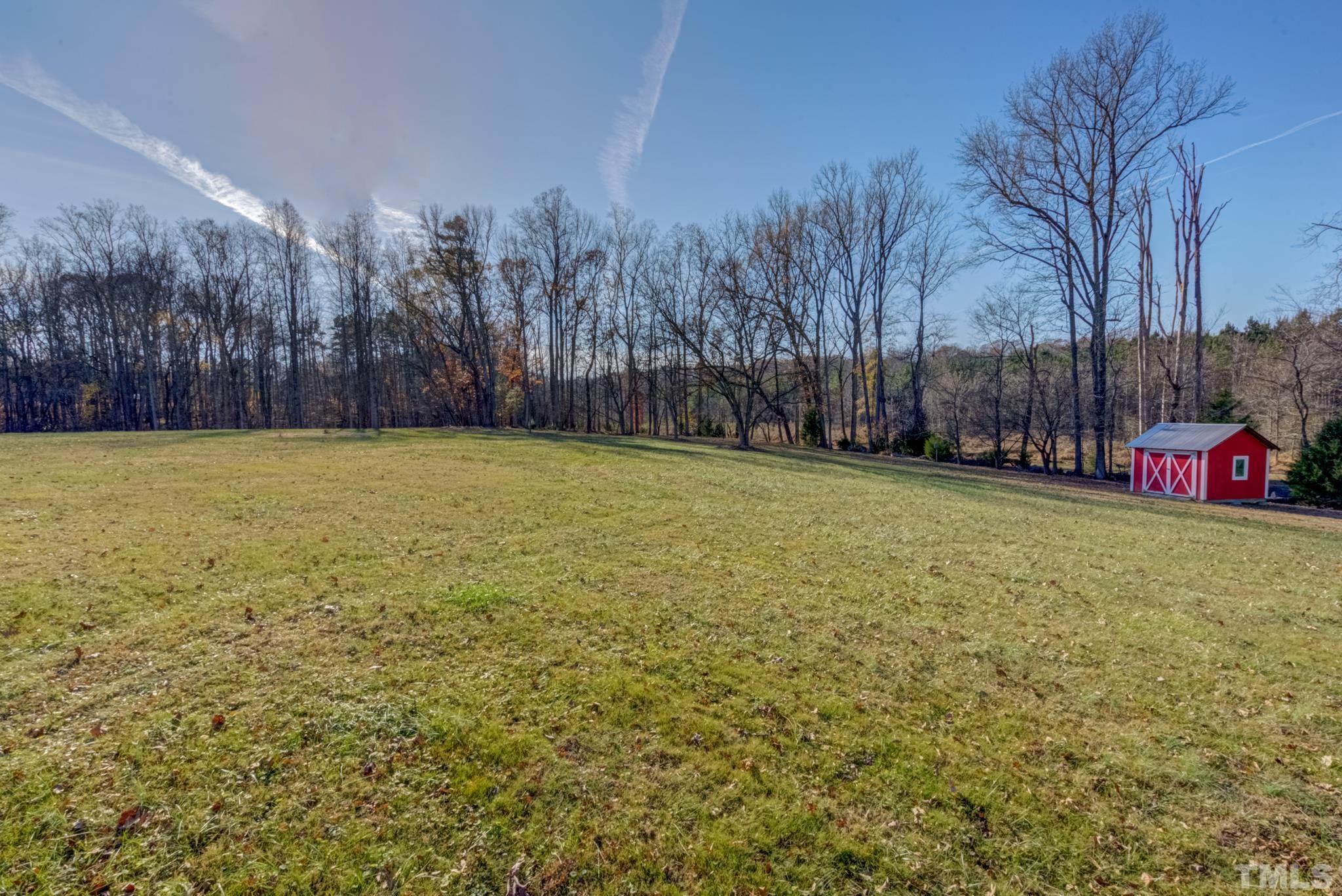2319 Cothran Road Rougemont, NC 27572 - Photo 34 of 39 a view of a field with trees in the background