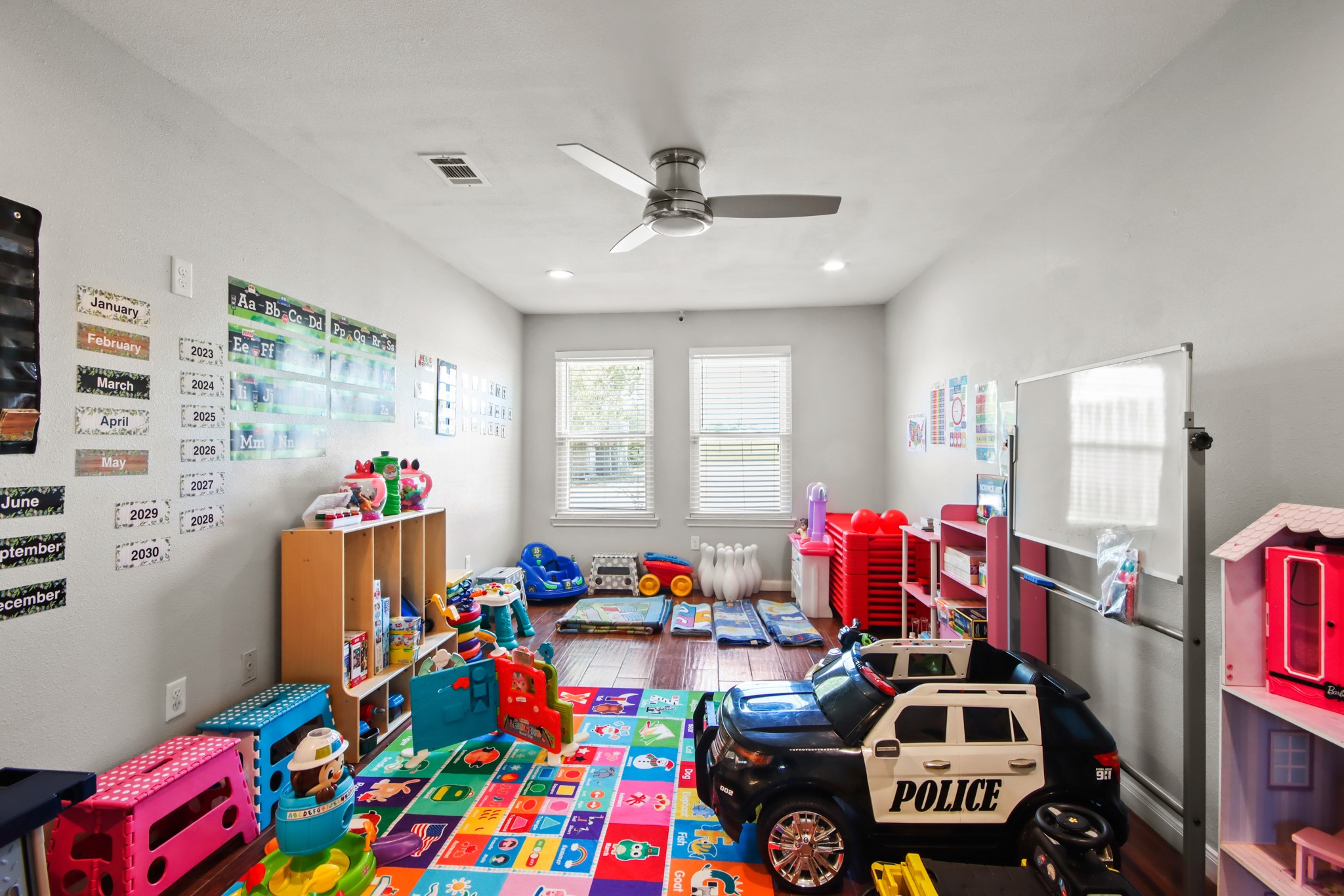 5302 Treaschwig Road Spring, TX 77373 - Photo 29 of 50 a living room filled with furniture and a baby crib