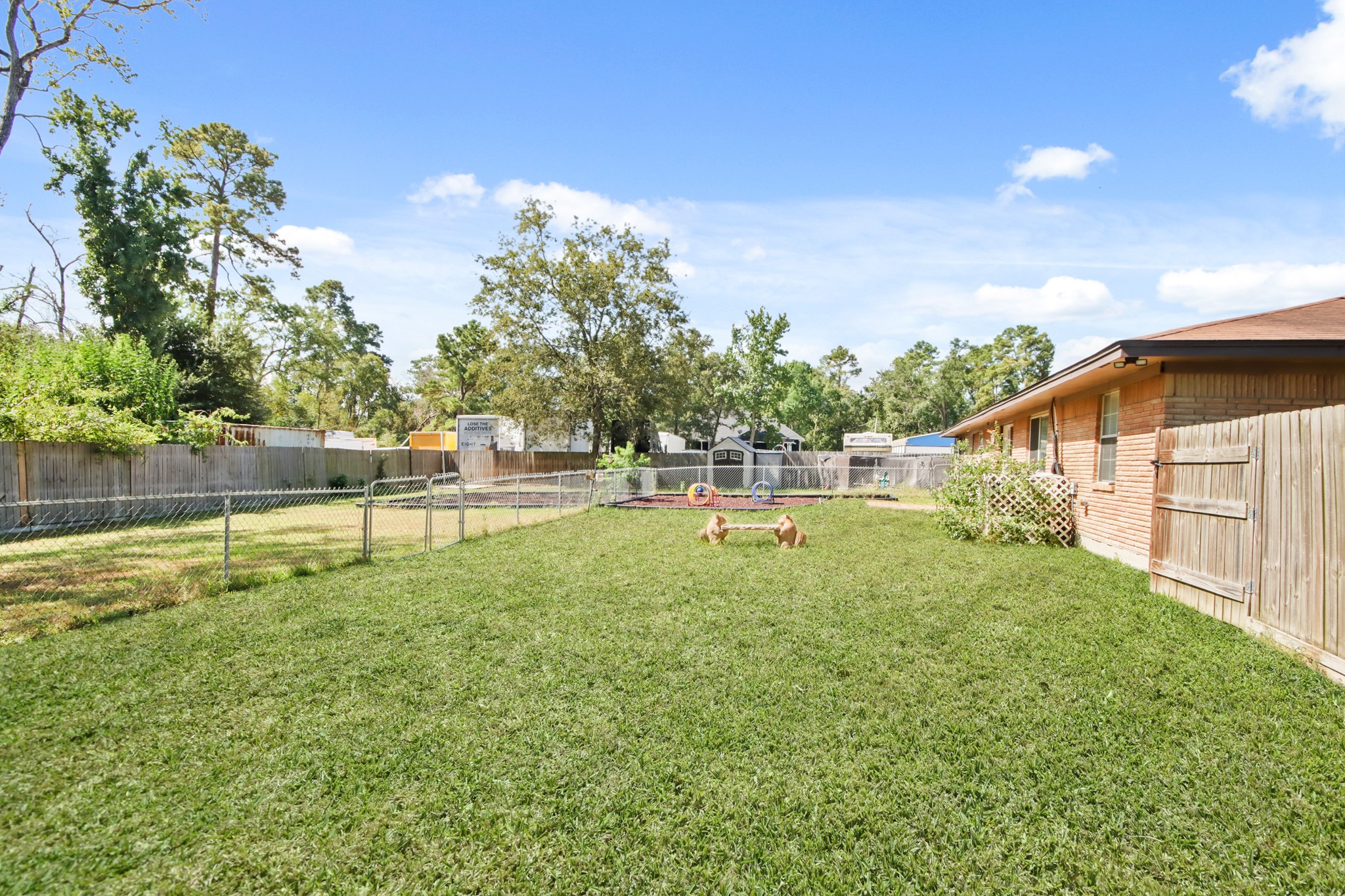 5302 Treaschwig Road Spring, TX 77373 - Photo 9 of 50 a swimming pool with lots of green space and fog