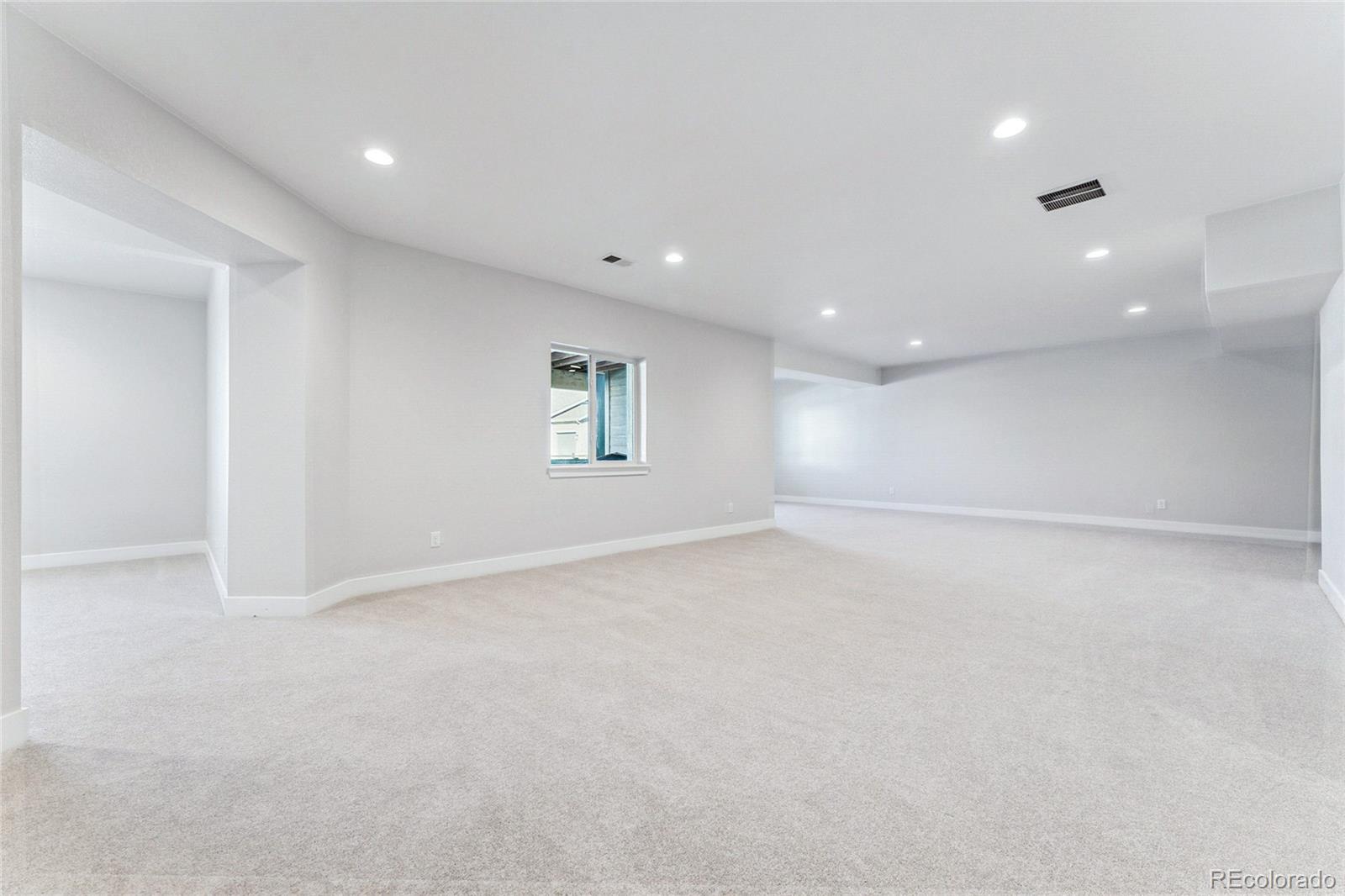 3877 Freestone Point Castle Rock, CO 80108 - Photo 26 of 48 an empty room with windows and closet