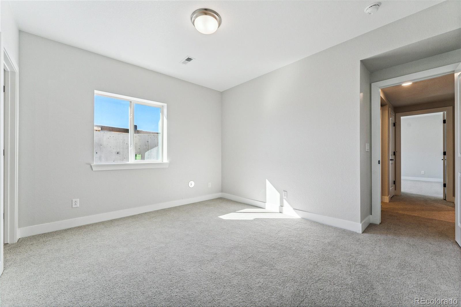3877 Freestone Point Castle Rock, CO 80108 - Photo 29 of 48 a view of an empty room with a window