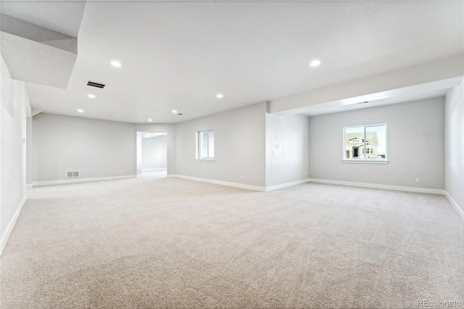 3877 Freestone Point Castle Rock, CO 80108 - Photo 3 of 48 a view of an empty room with a window
