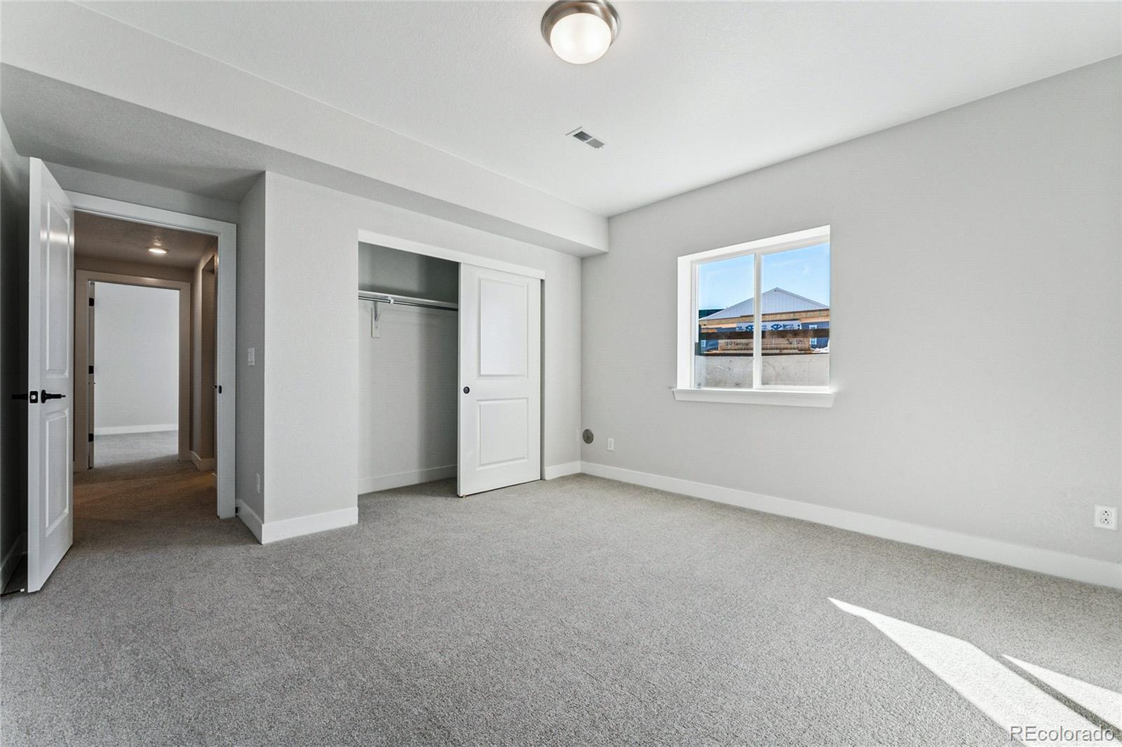 3877 Freestone Point Castle Rock, CO 80108 - Photo 32 of 48 an empty room with windows and closet