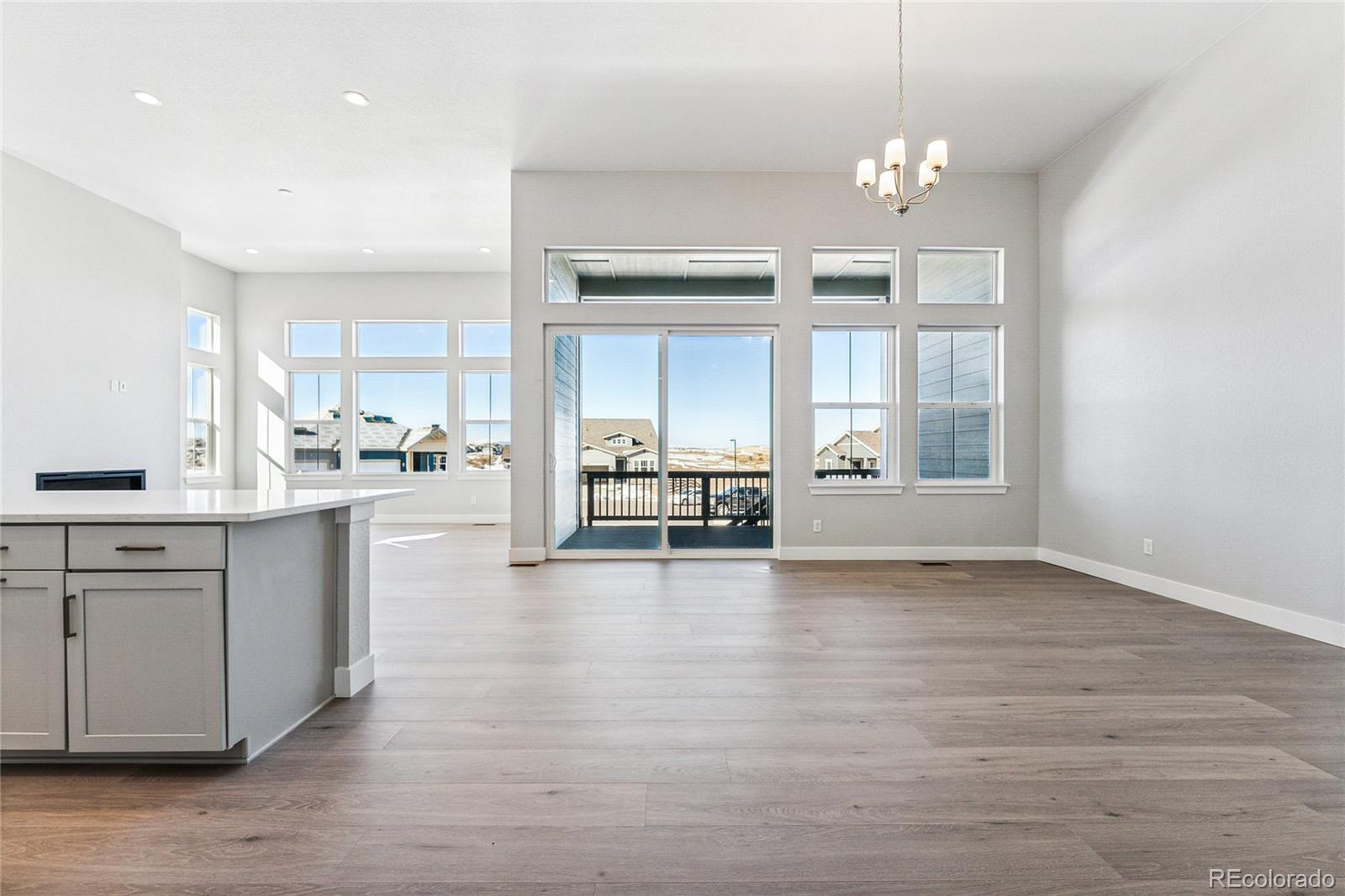 3877 Freestone Point Castle Rock, CO 80108 - Photo 37 of 48 a view of kitchen with sink microwave and cabinets