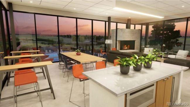 3877 Freestone Point Castle Rock, CO 80108 - Photo 44 of 48 a kitchen with a table chairs and wooden floor