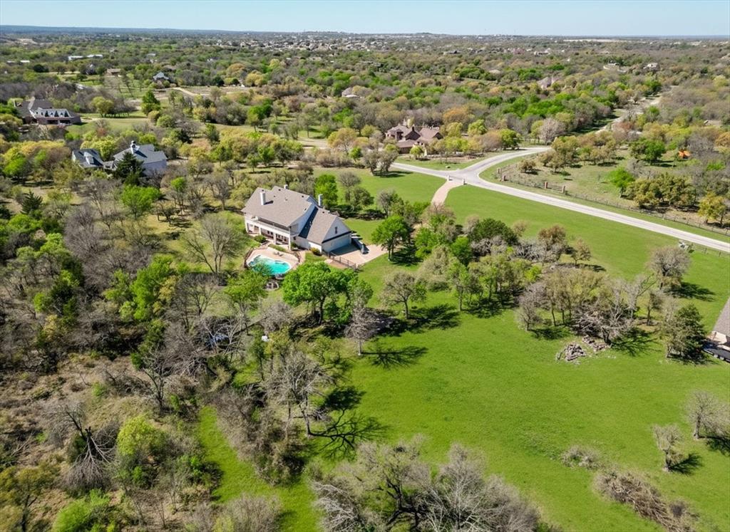166 East Rio Ridge Azle, TX 76020 - Photo 5 of 40 an aerial view of residential houses with outdoor space and trees all around