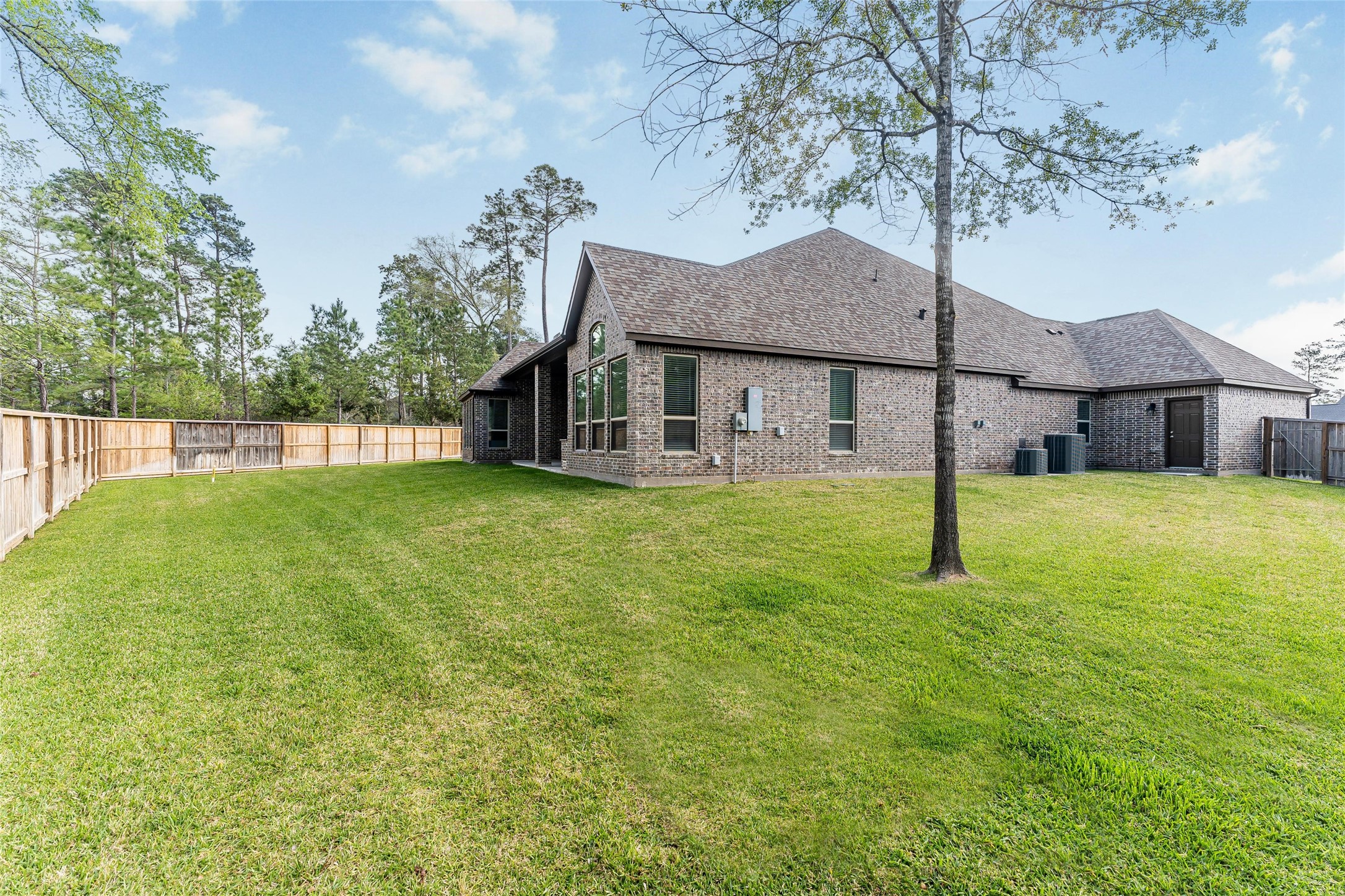 1050 Groveton Ridge Lane Pinehurst, TX 77362 - Photo 41 of 50 Look at the size of this huge back yard with no rear neighbors