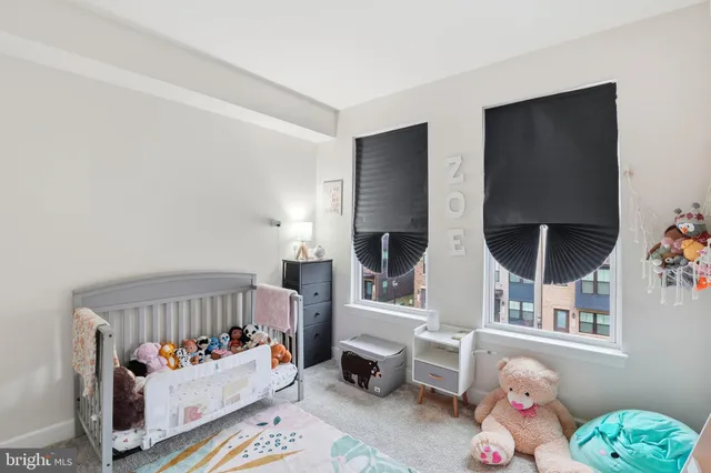 a bedroom with furniture and a window