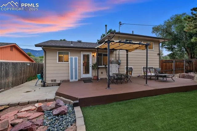 a view of a backyard with sitting area