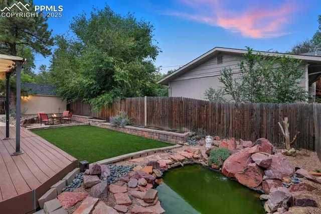 a backyard of a house with lots of green space