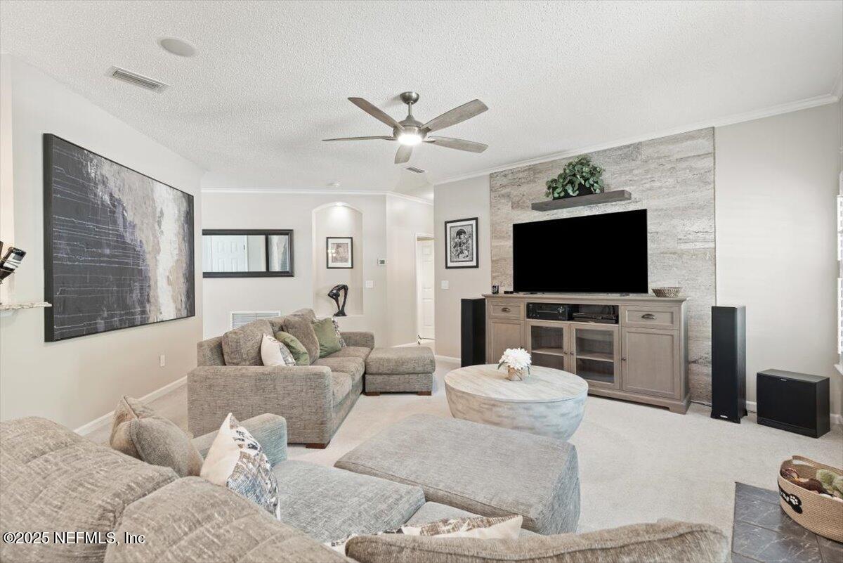 252 Crooked Court St. Johns, FL 32259 - Photo 13 of 72 a living room with furniture and a flat screen tv