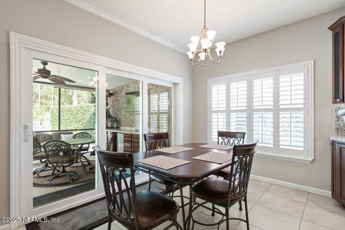 252 Crooked Court St. Johns, FL 32259 - Photo 16 of 72 a view of a dining room with furniture window and outside view