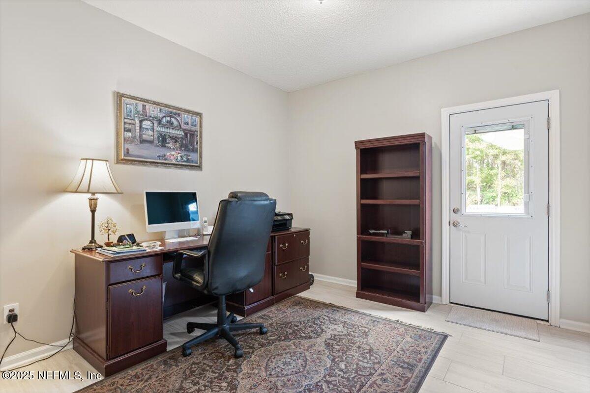 252 Crooked Court St. Johns, FL 32259 - Photo 21 of 72 a view of a workspace with furniture and a window
