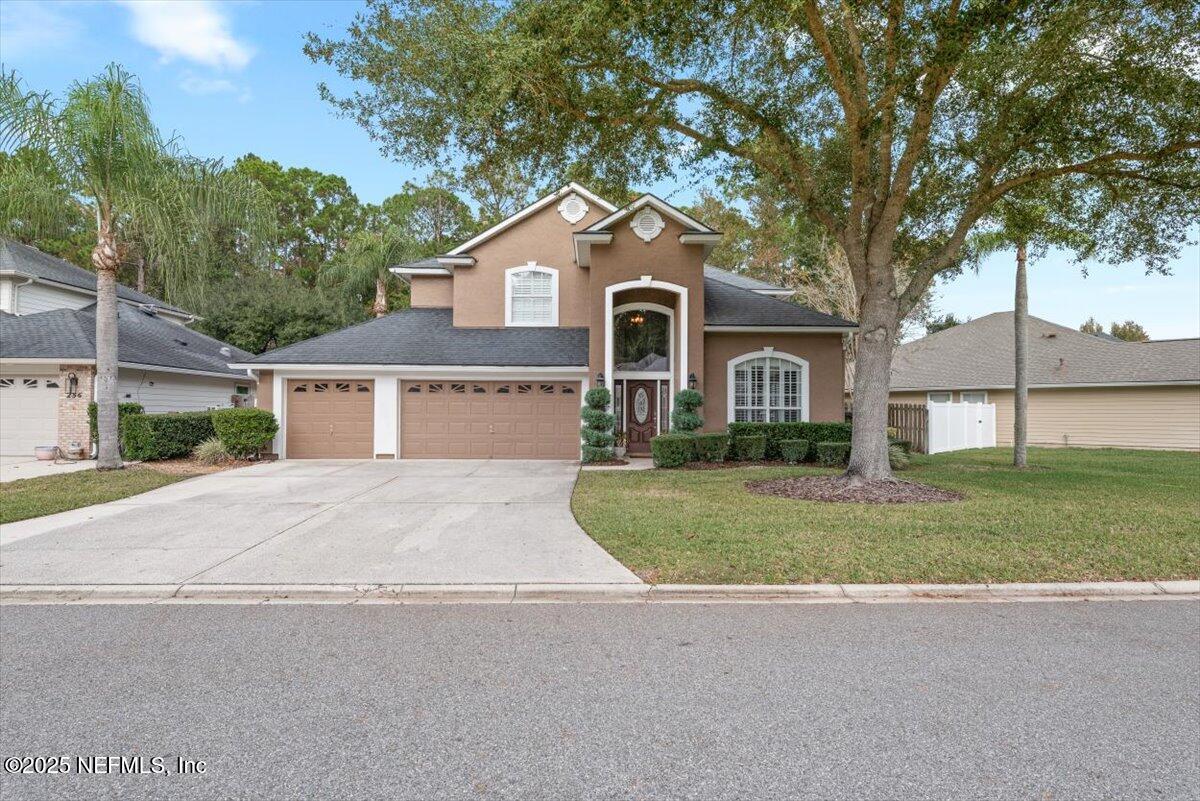 252 Crooked Court St. Johns, FL 32259 - Photo 3 of 72 a front view of a house with a yard and garage