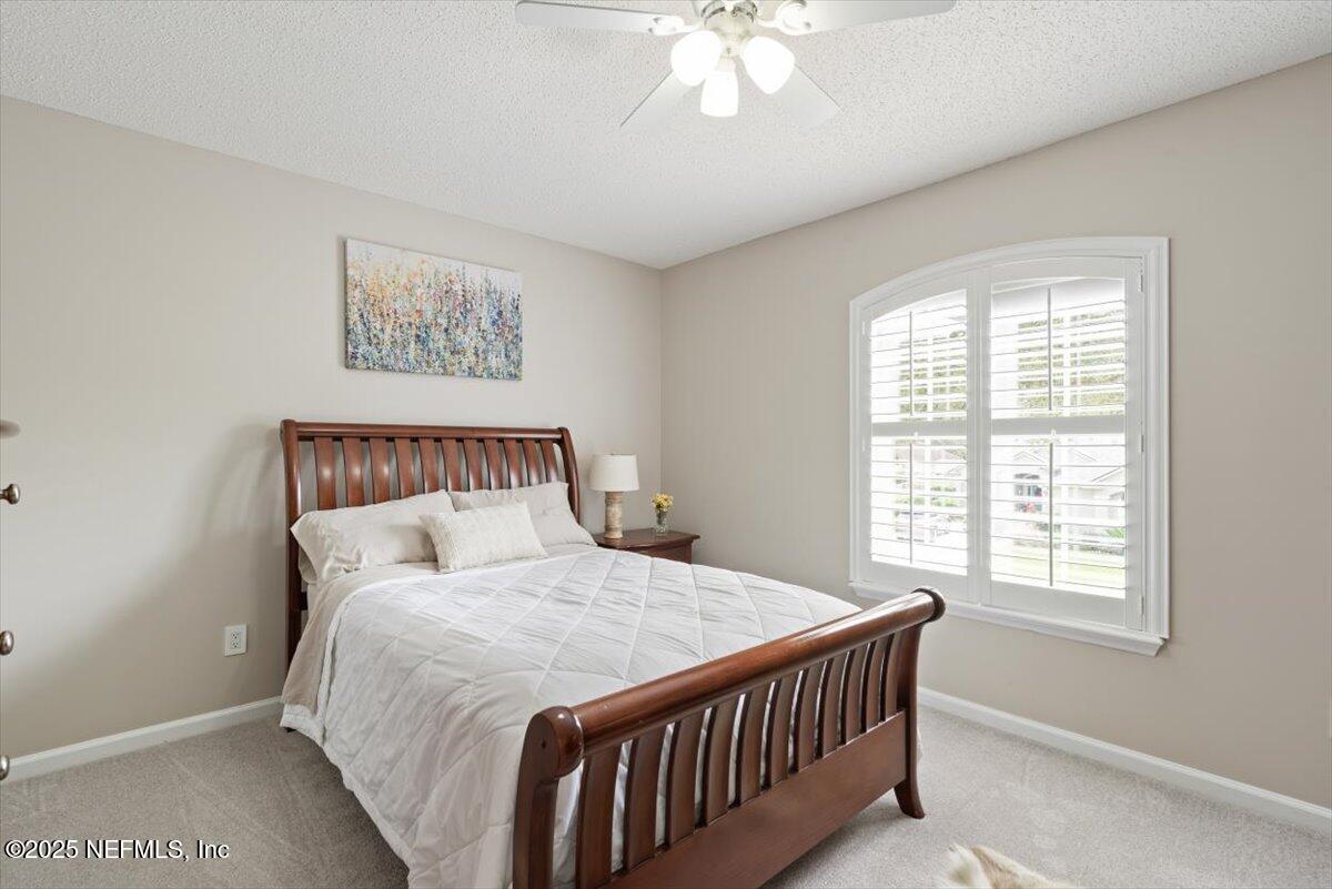 252 Crooked Court St. Johns, FL 32259 - Photo 33 of 72 a bedroom with a bed and a window