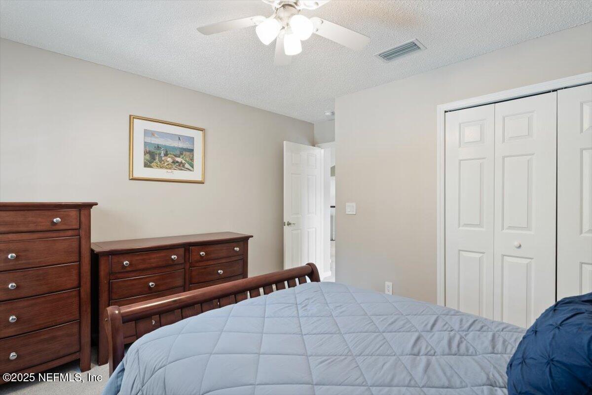252 Crooked Court St. Johns, FL 32259 - Photo 36 of 72 a bedroom with a bed and a dresser