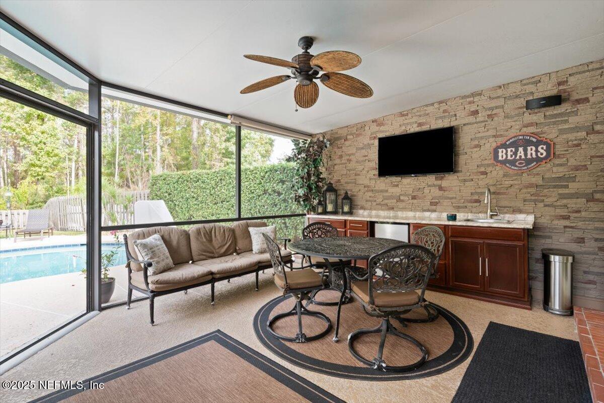 252 Crooked Court St. Johns, FL 32259 - Photo 39 of 72 a living room with furniture and a flat screen tv