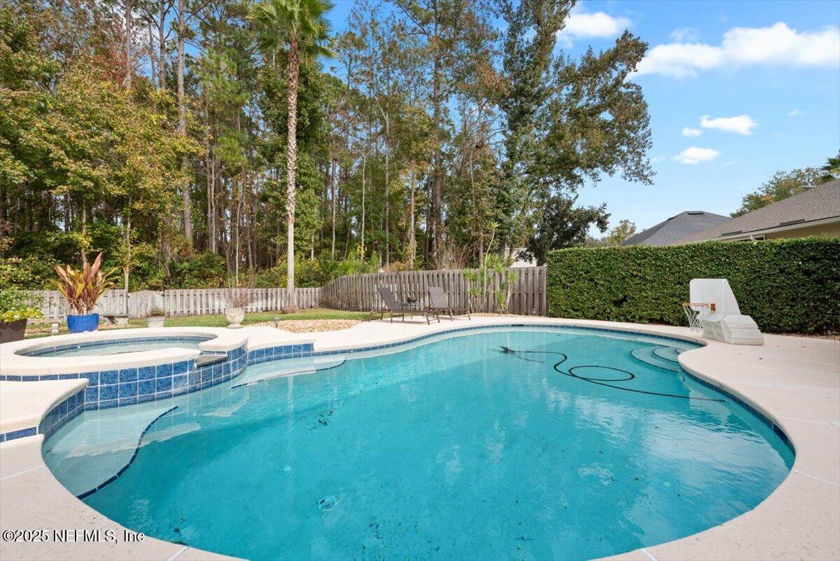 252 Crooked Court St. Johns, FL 32259 - Photo 41 of 72 a view of a swimming pool with a patio