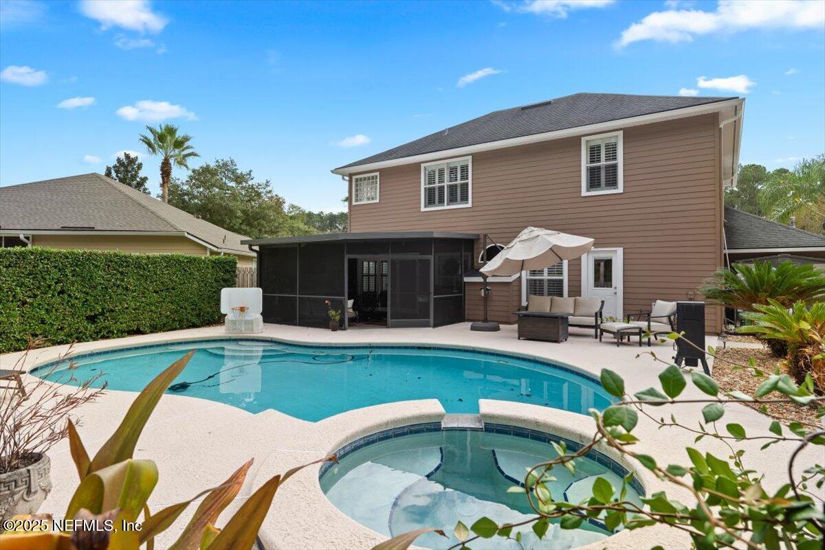 252 Crooked Court St. Johns, FL 32259 - Photo 43 of 72 a view of a house with swimming pool and sitting area