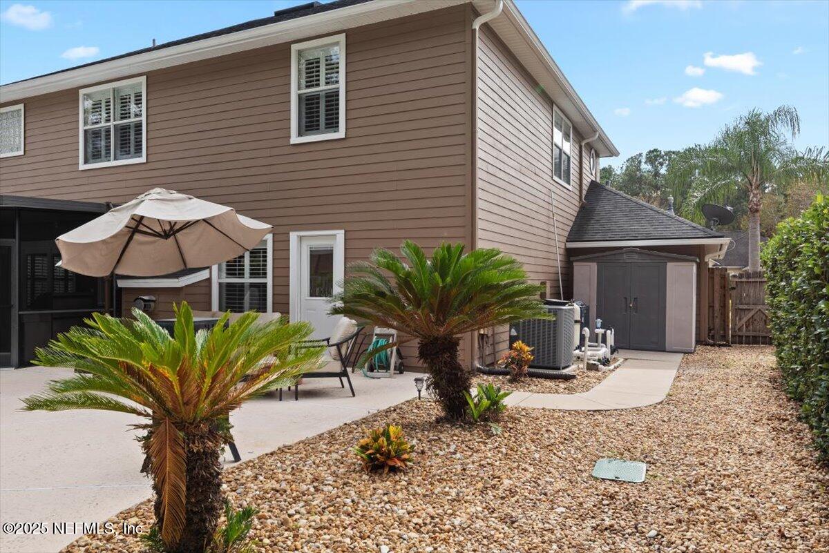 252 Crooked Court St. Johns, FL 32259 - Photo 50 of 72 a view of a house with backyard porch and sitting area