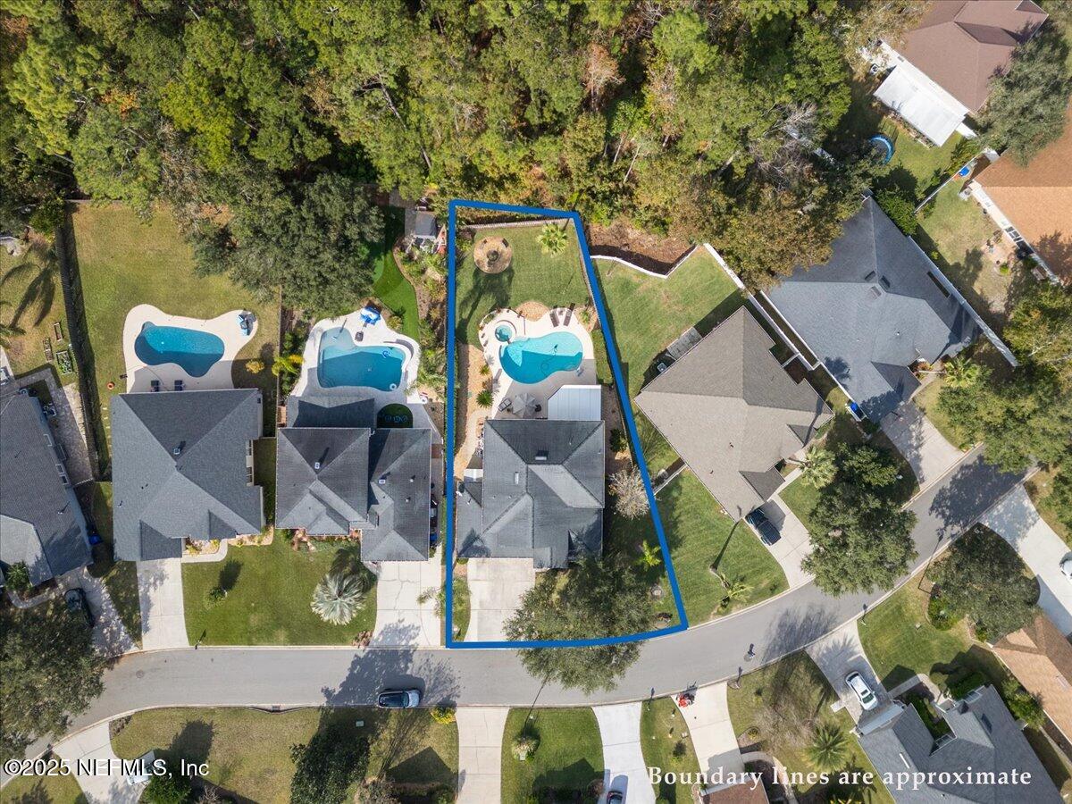 252 Crooked Court St. Johns, FL 32259 - Photo 51 of 72 an aerial view of a house with swimming pool and outdoor seating