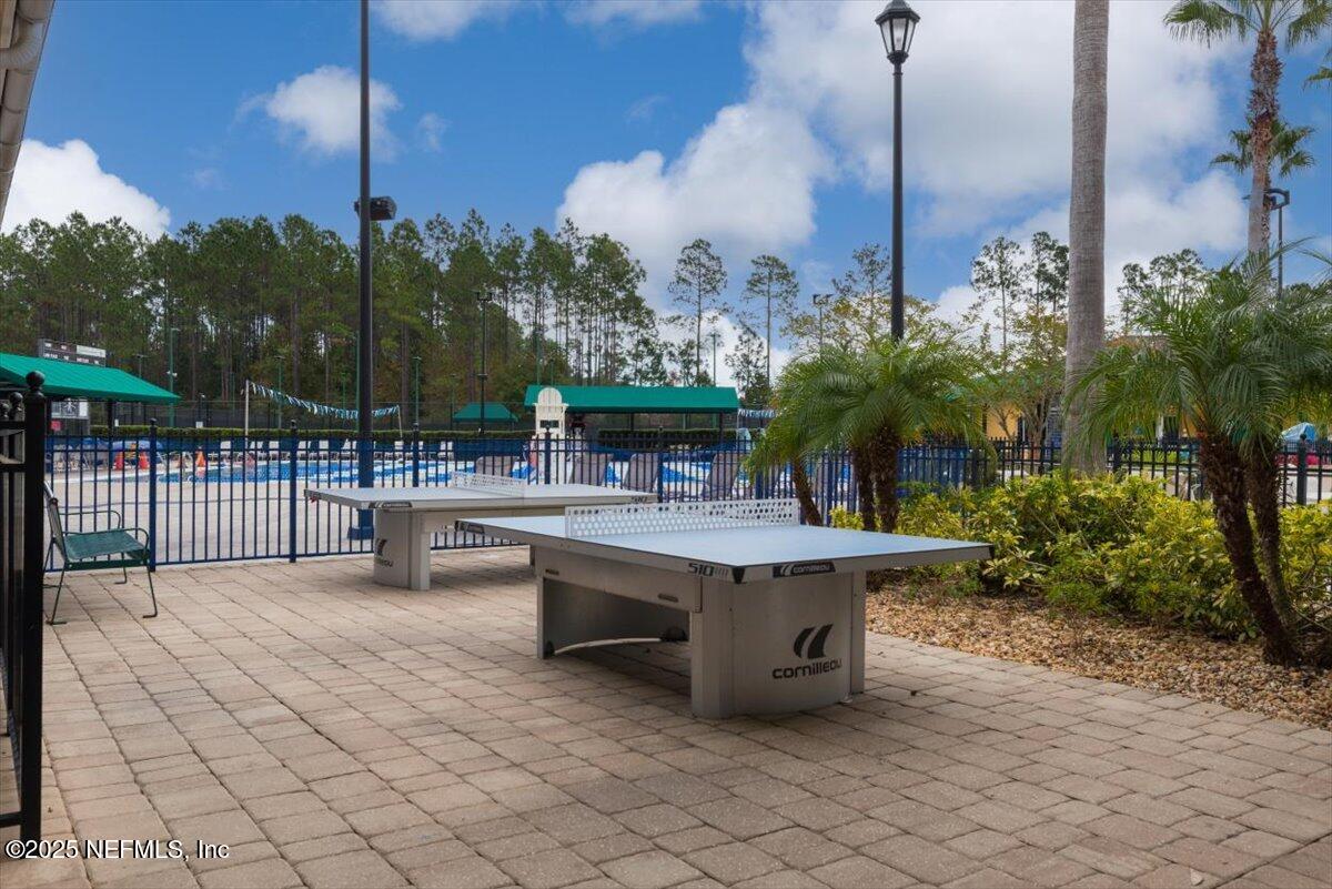 252 Crooked Court St. Johns, FL 32259 - Photo 60 of 72 a view of a patio with table and chairs potted plants