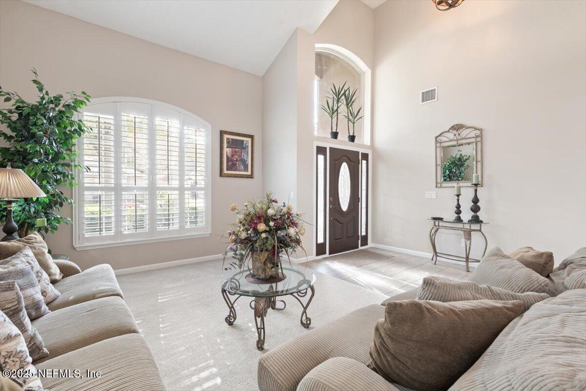 252 Crooked Court St. Johns, FL 32259 - Photo 6 of 72 a living room with furniture and a large window