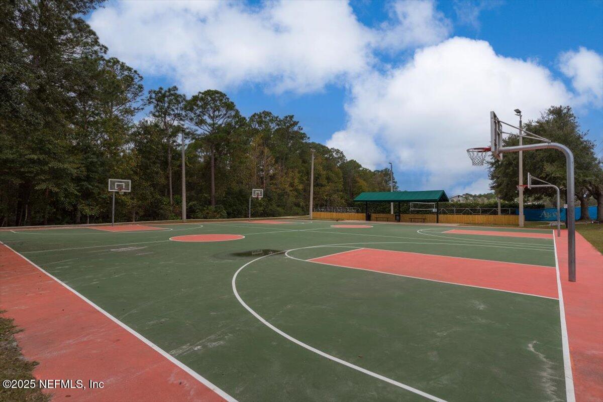 252 Crooked Court St. Johns, FL 32259 - Photo 71 of 72 a view of a tennis ground with large trees