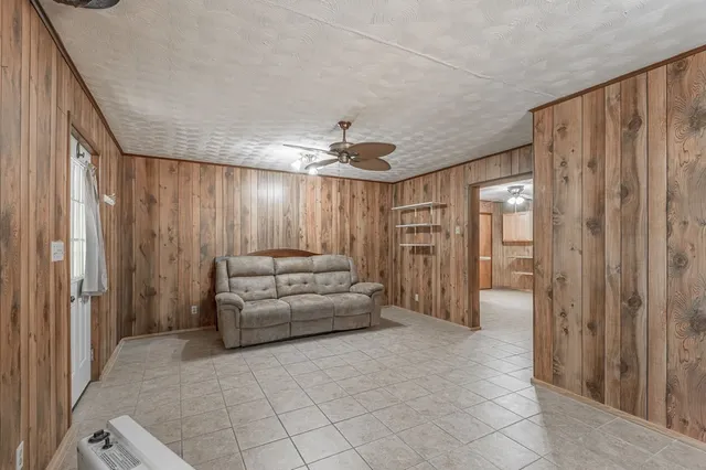 a large kitchen with cabinets and furniture