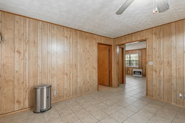 a kitchen with a refrigerator and a sink