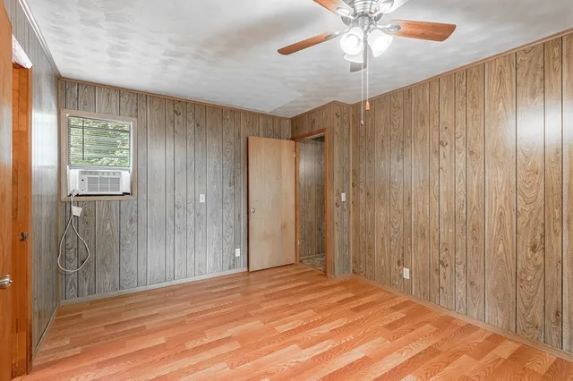 a bathroom with a granite countertop sink and a bathtub with shower