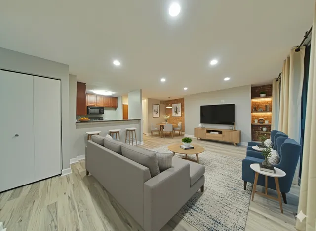 a living room with furniture and a flat screen tv