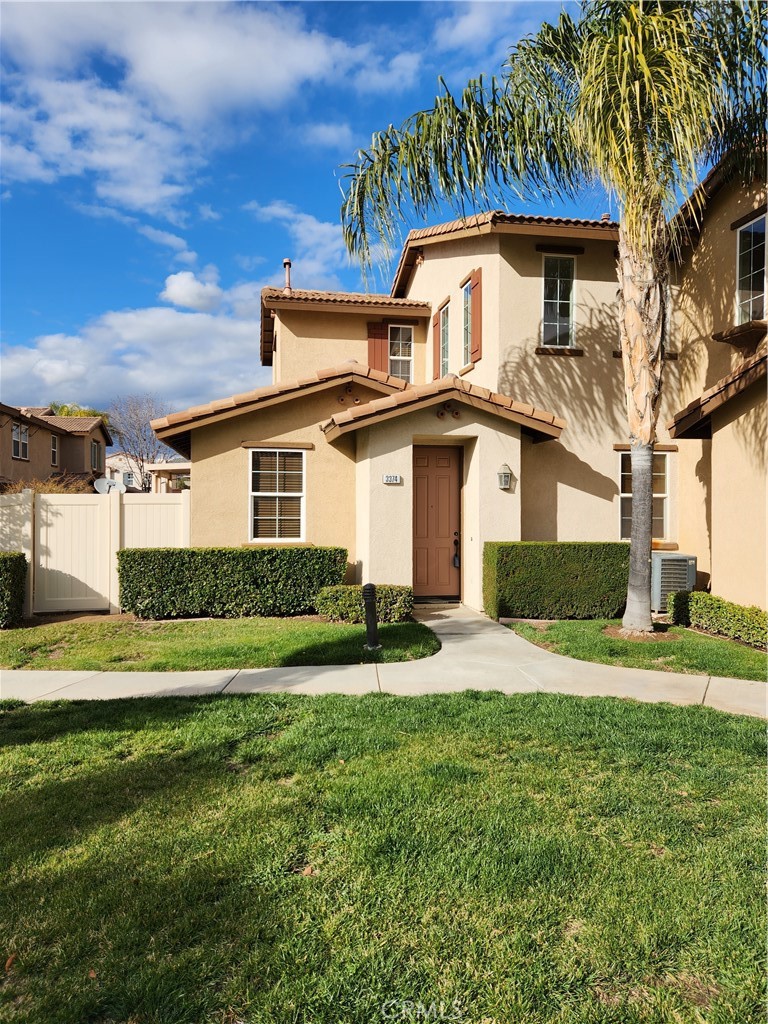 3374 Wind Chime Lane Perris, CA 92571 - Photo 1 of 1 a front view of a house with a yard and garage