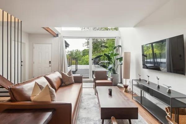 a living room with furniture and a large window