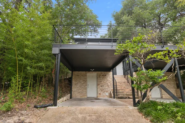 a view of a chairs and table in the patio
