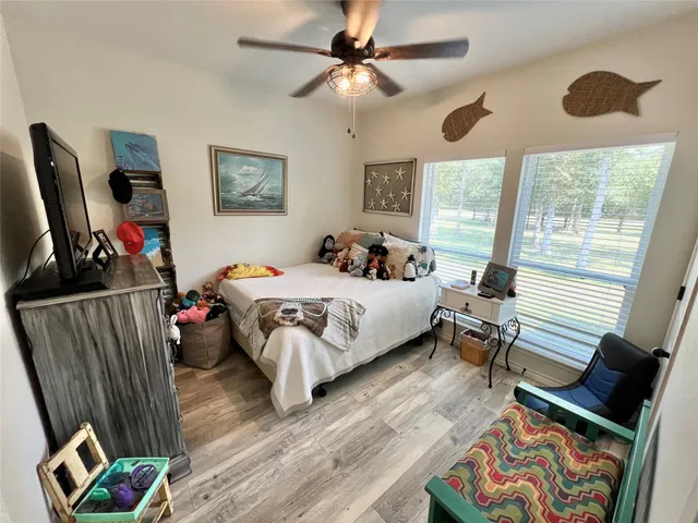 a bedroom with bed and window