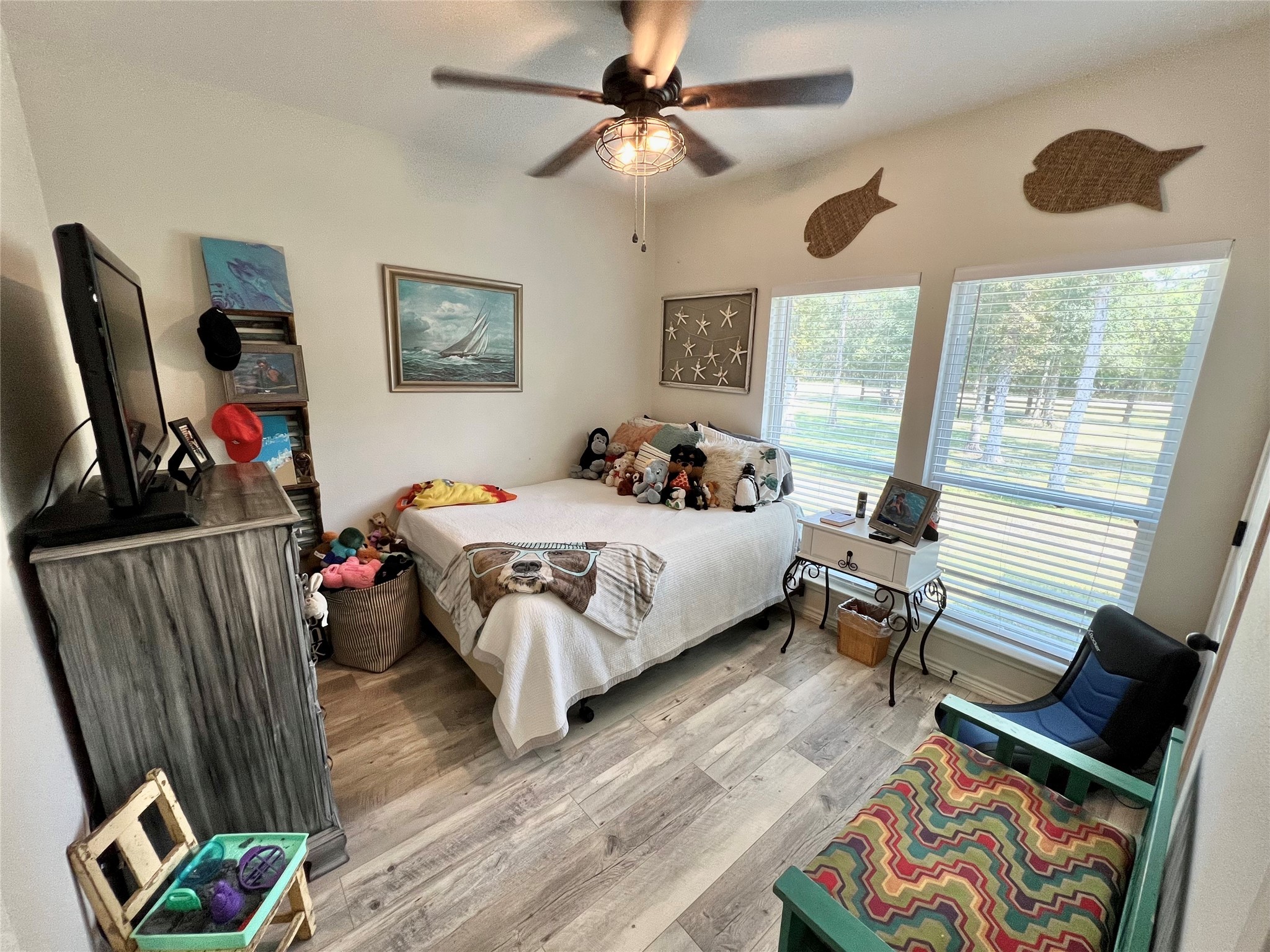 22740 Brazos Circle Damon, TX 77430 - Photo 20 of 30 a bedroom with bed and window