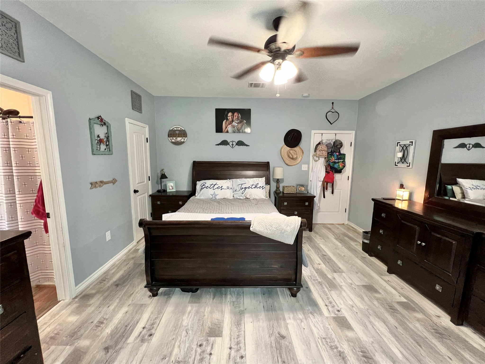 22740 Brazos Circle Damon, TX 77430 - Photo 24 of 30 a bedroom with a bed and wooden floor