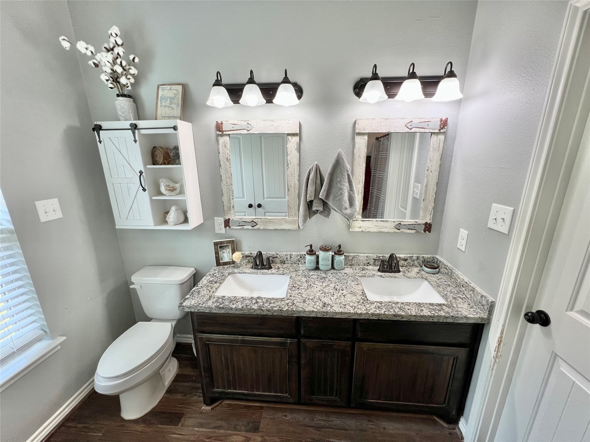22740 Brazos Circle Damon, TX 77430 - Photo 26 of 30 a bathroom with double vanity sinks and a toilet