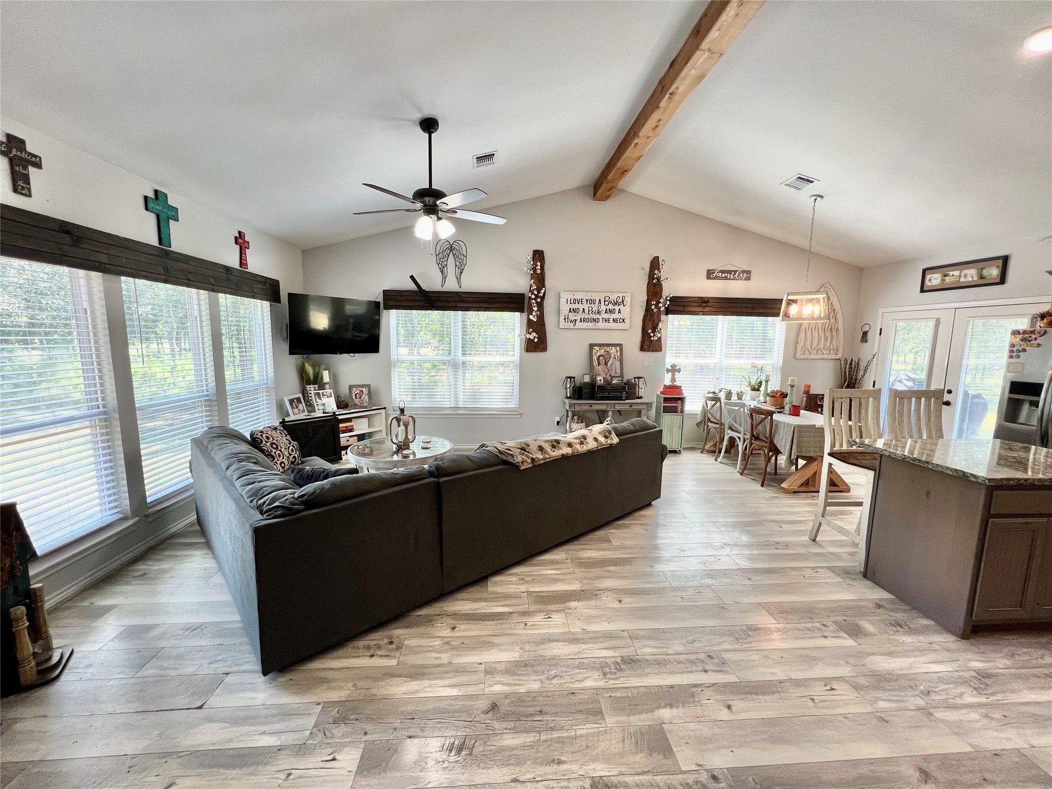 22740 Brazos Circle Damon, TX 77430 - Photo 5 of 30 a kitchen with stainless steel appliances granite countertop a stove oven and a view of living room